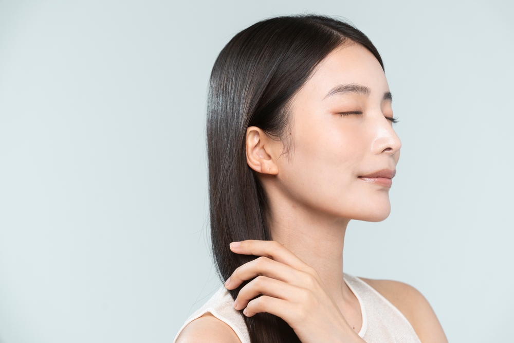 Hair,Car.a,Woman,Is,Touching,Her,Hair.