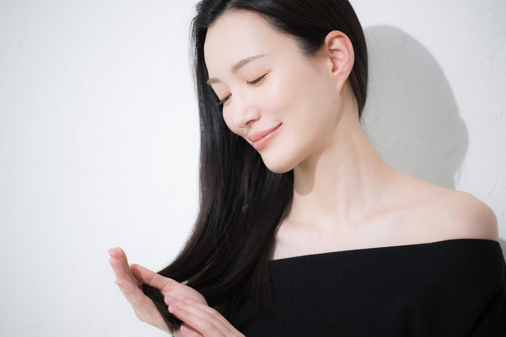 Young,Beautiful,Japanese,Woman,With,Long,Black,Hair,Touching,Her